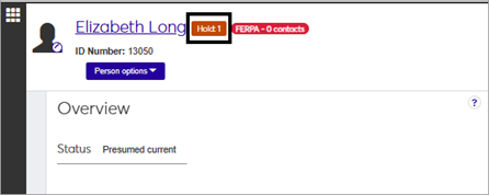 J1 Web CM Person Search result showing a hold alert.